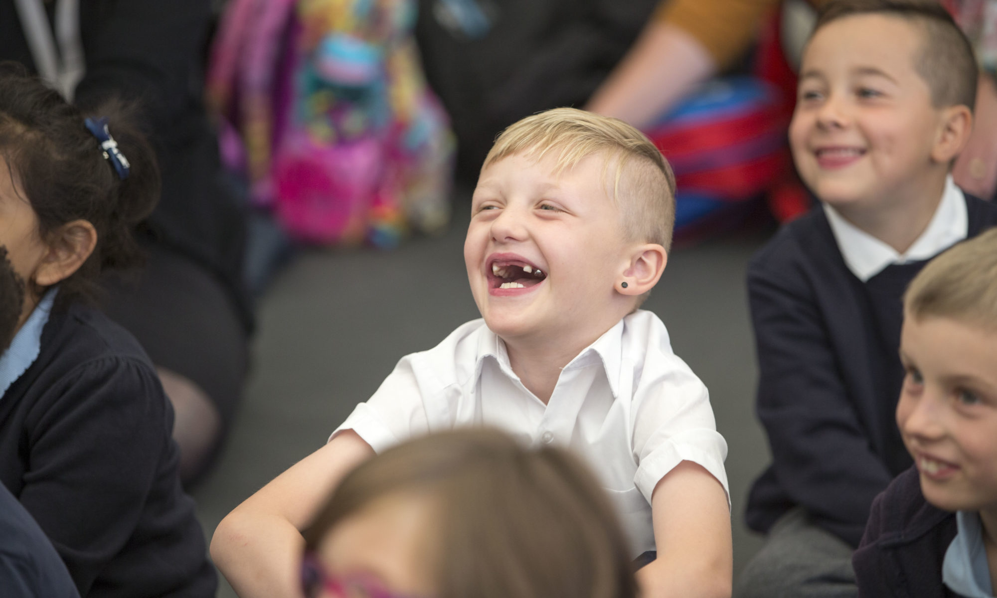 Boy laughing at a Book Festival event